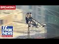 BREAKING: Protesters CLIMB Empire State Building spire