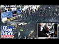 CHAOS: Angry protesters berate federal agents at Minneapolis shooting scene