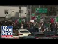 BREAKING: Rioters shut down California freeway