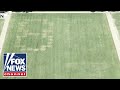 '86 47' VANDALIZED on grass at National Mall