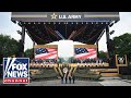 Trump admin stands for National Anthem at Army parade