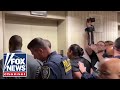ICE faces protesters, angry lawmakers: 11 Democrats arrested