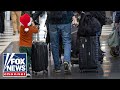 LIVE: Christmas travel rush surges as TSA projects record airport crowds