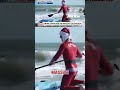Hundreds of surfing Santas ride the waves in Cocoa Beach #shorts