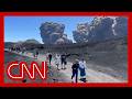 Video shows tourists running for safety as Etna erupts