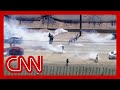 Watch intense standoff outside California farm between protesters and federal agents