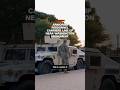 Armored personnel carriers line up near Washington Monument