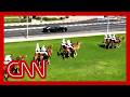 Trump welcomed to Qatar with red Cybertrucks and mounted camels