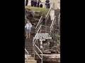Beachgoer unknowingly crashes fashion show