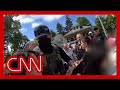 Bodycam video shows residents trying to stop ICE agents from arresting woman