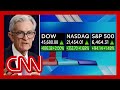 DOW soars into record territory as Powell hints at rate cut