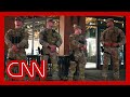 National Guard begins carrying firearms in DC
