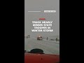 Truck narrowly avoids state trooper in winter storm