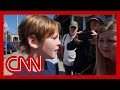 Fifth grader says a friend shielded him as shots were fired during Mass