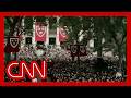 Harvard president gets a minute-long standing ovation as commencement program starts